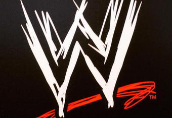 NEW YORK - MARCH 18:  The World Wrestling Entertainment logo hangs on a wall at a media conference announcing the all-star lineup of WWE WrestleMania XIX at ESPN Zone in Times Square March 18, 2003 in New York City.  (Photo by Mark Mainz/Getty Images)
