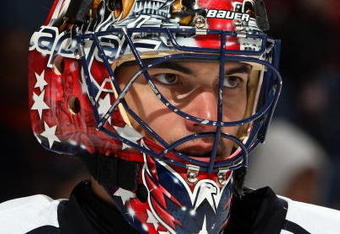 UNIONDALE, NY - OCTOBER 24:  Jose Theodore #60 of the Washington Capitals looks on against the New York Islanders on October 24, 2009 at Nassau Coliseum in Uniondale, New York. The Capitals won the game 3-2 in overtime.  (Photo by Jim McIsaac/Getty Images)