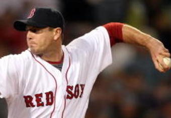 BOSTON - SEPTEMBER 29:  Billy Wagner #13 of the Boston Red Sox delivers a pitch in the eighth inning against the Toronto Blue Jays on September 29, 2009 at Fenway Park in Boston, Massachusetts.  (Photo by Elsa/Getty Images)