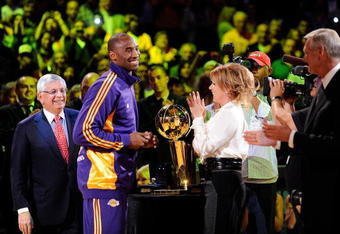 LOS ANGELES, CA - OCTOBER 27:  Kobe Bryant #24 of the Los Angeles Lakers receives his championship ring from Executive Vice President of Business Operations Jeanie Buss before the season opening game against the Los Angeles Clippers at Staples Center on October 27, 2009 in Los Angeles, California.  NOTE TO USER: User expressly acknowledges and agrees that, by downloading and or using this photograph, User is consenting to the terms and conditions of the Getty Images License Agreement. Mandatory Copyright Notice: Copyright 2009 NBAE  (Photo by Kevork Djansezian/Getty Images)