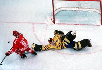 27 FEB 1994:  GOALKEEPER TOMMY SALO OF SWEDEN STOPS CANADA's PAUL KARIYA IN AN OVERTIME SHOOTOUT, TO WIN THE HOCKEY FINAL, 3-2,  AT THE 1994 WINTER OLYMPICS IN LILLEHAMMER.  Mandatory Credit: Chris Cole/ALLSPORT