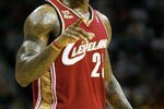 CLEVELAND - OCTOBER 27:  LeBron James #23 of the Cleveland Cavaliers reacts during the season opener against the Boston Celtics at Quicken Loans Arena on October 27, 2009 in Cleveland, Ohio.  NOTE TO USER: User expressly acknowledges and agrees that, by downloading and or using this photograph, User is consenting to the terms and conditions of the Getty Images License Agreement. (Photo by Gregory Shamus/Getty Images)