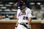 NEW YORK - SEPTEMBER 23:  Daniel Murphy #28 of the New York Mets walks to the dugout after striking out against the Atlanta Braves during the game on September 23, 2009 at Citi Field in the Flushing neighborhood of the Queens borough of New York City.  (Photo by Jared Wickerham/Getty Images)
