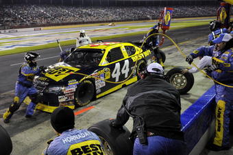 CONCORD, NC - OCTOBER 17:  AJ Allmendinger, driver of the #44 Best Buy Dodge, makes a pit stop during the NASCAR Sprint Cup Series NASCAR Banking 500 at Lowe's Motor Speedway on October 17, 2009 in Concord, North Carolina.  (Photo by John Harrelson/Getty Images for NASCAR)