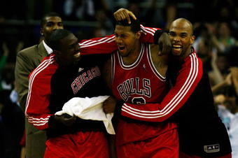 LONDON, ENGLAND - OCTOBER 06:  James Johnson (C) of the Chicago Bulls celebrates with team mates after scoring the winning shot in the final second during the NBA pre-season game as part of the 2009 NBA Europe Live Tour between Chicago Bulls and Utah Jazz at the O2 Arena on October 6, 2009 in London, England.  NOTE TO USER: User expressly acknowledges and agrees that, by downloading and/or using this Photograph, user is consenting to the terms and conditions of the Getty Images License Agreement.  (Photo by Clive Rose/Getty Images)