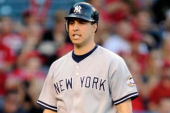 ANAHEIM, CA - OCTOBER 22:  Mark Teixeira #25 of the New York Yankees reacts after striking out during the first inning in Game Five of the ALCS against the Los Angeles Angels of Anaheim during the 2009 MLB Playoffs at Angel Stadium on October 22, 2009 in Anaheim, California.  (Photo by Kevork Djansezian/Getty Images)