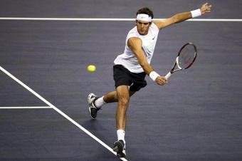 SHANGHAI, CHINA - OCTOBER 14: Juan Martin del Potro of Argentina returns a shot to Jurgen Melzer of Austria during day four of 2009 Shanghai ATP Masters 1000 at the Qi Zhong Tennis Centre on October 14, 2009 in Shanghai, China.  (Photo by Victor Fraile/Getty Images)