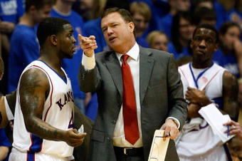LAWRENCE, KS - FEBRUARY 18:  Head coach Bill Self of the Kansas Jayhawks talks with Sherron Collins #4 during the game against the Iowa State Cyclones at Allen Fieldhouse February 18, 2009 in Lawrence, Kansas.  (Photo by Jamie Squire/Getty Images)