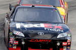 MARTINSVILLE, VA - OCTOBER 25:  Denny Hamlin, driver of the #11 FedEx Freight Toyota, leads Kevin Harvick, driver of the #29 Shell/Pennzoil Chevrolet, during the NASCAR Sprint Cup Series TUMS Fast Relief 500 at Martinsville Speedway on October 25, 2009 in Martinsville, Virginia.  (Photo by John Harrelson/Getty Images)