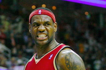 CLEVELAND - OCTOBER 27:  LeBron James #23 of the Cleveland Cavaliers reacts during the season opener against the Boston Celtics at Quicken Loans Arena on October 27, 2009 in Cleveland, Ohio.  NOTE TO USER: User expressly acknowledges and agrees that, by downloading and or using this photograph, User is consenting to the terms and conditions of the Getty Images License Agreement. (Photo by Gregory Shamus/Getty Images)