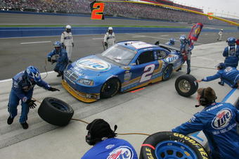 FONTANA, CA - OCTOBER 11:  Kurt Busch, driver of the #2 Miller Lite Dodge, makes a pit stop during the NASCAR Sprint Cup Series Pepsi 500 at Auto Club Speedway on October 11, 2009 in Fontana, California.  (Photo by Todd Warshaw/Getty Images)