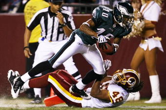 LANDOVER, MD - OCTOBER 26:  DeSean Jackson #10 of the Philadelphia Eagles trips over Chris Horton #48 of the Washington Redskins to score a touchdown in the second quarter of the game at FedEx Field October 26, 2009 in Landover, Maryland. (Photo by Win McNamee/Getty Images)