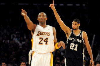 LOS ANGELES, CA - JANUARY 25:  Tim Duncan #21 of the San Antonio Spurs reacts to a foul next to Kobe Bryant #24 of the Los Angeles Lakers during the forth quarter at the Staples Center on January 25, 2009 in Los Angeles, California.  The Lakers defeated the Spurs 99-85.  NOTE TO USER:  User expressly acknowledges and agrees that, by downloading and/or using this photograph, User is consenting to the terms and conditions of the Getty Images License Agreement.  (Photo by Harry How/Getty Images)