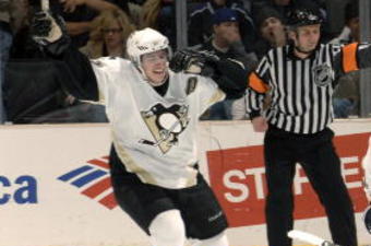 LOS ANGELES - NOVEMBER 1:  Evgeni Malkin #71of the Pittsburgh Penguins celebrates with teammates Sidney Crosby #87 and Mark Recchi #8 after Evgeni scored the game winning goal in overtime against the Los Angeles Kings on November 1, 2006 at the Staples Center in Los Angeles, California. The Penguins beat the Kings 4-3 in overtime.  (Photo by Noah Graham/Getty Images)