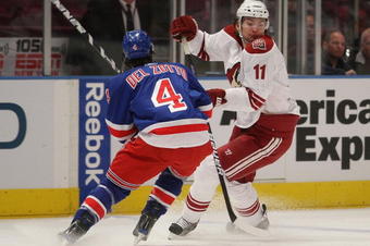 NEW YORK - OCTOBER 26:  Michael Del Zotto #4 of the New York Rangers lines up Martin Hanzal #11 of the Phoenix Coyotes at Madison Square Garden on October 26, 2009 in New York, New York. (Photo by Bruce Bennett/Getty Images)