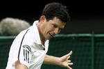 LONDON, ENGLAND - MAY 17:  Tim Henman hits a backhand during the Mens Singles match against Andre Agassi during the 'Centre Court Celebration' at Wimbledon on May 17, 2009 in London, England.  (Photo by Hamish Blair/Getty Images)