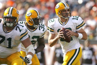 CLEVELAND, OH - OCTOBER 25:  Aaron Rodgers #12 of the Green Bay Packers drops back to pass as he gets protection from Brandon Jackson #32 and Josh Sitton #71 against the Cleveland Browns at Cleveland Browns Stadium on October 25, 2009 in Cleveland, Ohio.  (Photo by Matt Sullivan/Getty Images)