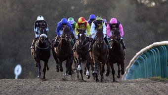LINGFIELD, ENGLAND - OCTOBER 29:  Frankie Dettori has Siroco Breeze (2ndL) handily placed before landing The Coral All-Weather 20TH Anniversary Handicap Stakes Race run at Lingfield Racecourse on October 29, 2009 in Lingfield, England.  (Photo by Simone Joyner/Getty Images)