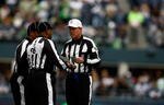 SEATTLE , WA - OCTOBER 18:  Referees talks during the Seattle Seahawks game against the Arizona Cardinals at Qwest Field on October 18, 2009 in Seattle, Washington.  (Photo by Jonathan Ferrey/Getty Images)