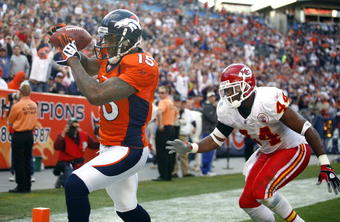 DENVER - DECEMBER 7:  Wide receiver Brandon Marshall #15 of the Denver Broncos catches a touchdown pass in front of Jarrad Page #44 of the Kansas City Chiefs during the second quarter of week 14 NFL action at Invesco Field at Mile High on December 7, 2008 in Denver, Colorado.(Photo by Marc Piscotty/Getty Images)