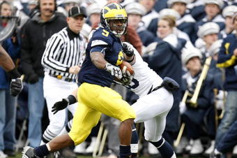 ANN ARBOR, MI - OCTOBER 24: Martavious Odoms #9 of the Michigan Wolverines tries to get around the tackle of Nick Sukay #18 of the Penn State Nittany Lions on October 24, 2009 at Michigan Stadium in Ann Arbor, Michigan. Penn State won the game 35-10. (Photo by Gregory Shamus/Getty Images)