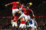 MANCHESTER, UNITED KINGDOM - FEBRUARY 21:  Cristiano Ronaldo of Manchester United goes up for a header with team mate Jonny Evans (R) during the Barclays Premier League match between Manchester United and Blackburn Rovers at Old Trafford on February 21, 2009 in Manchester, England.  (Photo by Jamie McDonald/Getty Images)