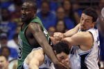 ORLANDO, FL - MAY 08:  J.J. Redick #7 of the Orlando Magic (C) is fouled by Kendrick Pewrkins #43 of the Boston Celtics (L) in Game Three of the Eastern Conference Semifinals during the 2009 NBA Playoffs at Amway Arena on May 8, 2009 in Orlando, Florida. NOTE TO USER: User expressly acknowledges and agrees that, by downloading and or using this photograph, User is consenting to the terms and conditions of the Getty Images License Agreement.  (Photo by Marc Serota/Getty Images)