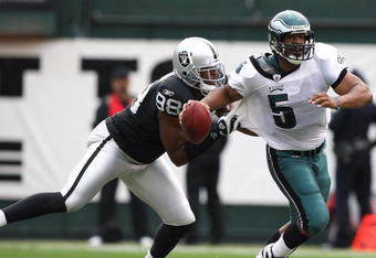 OAKLAND, CA - OCTOBER 18:  Donovan McNabb #5 of the Philadelphia Eagles is sacked by Jay Richardson #98 of the Oakland Raiders during an NFL game at the Oakland-Alameda County Coliseum on October 18, 2009 in Oakland, California.  (Photo by Jed Jacobsohn/Getty Images)