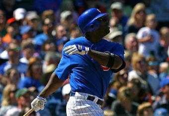 CHICAGO - AUGUST 30: Milton Bradley #21 of the Chicago Cubs follows the flight of the ball against the New York Mets on August 30, 2009 at Wrigley Field in Chicago, Illinois. The Mets defeated the Cubs 4-1. (Photo by Jonathan Daniel/Getty Images)