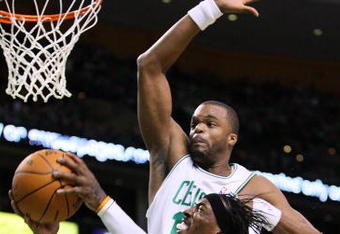 BOSTON, MA - OCTOBER 28: Shelden Williams #13 of the Boston Celtics attempts to block the shot of Gerald Wallace #3 of Charlotte Bobcats at the TD Banknorth Garden on October 28, 2009 in Boston, Massachusetts. NOTE TO USER: User expressly acknowledges and agrees that, by downloading and/or using this Photograph, user is consenting to the terms and conditions of the Getty Images License Agreement. (Photo by Jim Rogash/Getty Images)