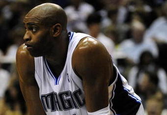 ORLANDO, FL - OCTOBER 28:  Vince Carter #15 of the Orlando Magic rests on the court during the game against the Philadelphia 76ers on October 28, 2009 at Amway Arena in Orlando, Florida.  NOTE TO USER: User expressly acknowledges and agrees that, by downloading and/or using this Photograph, user is consenting to the terms and conditions of the Getty Images License Agreement.  (Photo by Sam Greenwood/Getty Images)