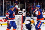 UNIONDALE, NY - OCTOBER 31:  Jeff Tambellini #15 of the New York Islanders celebrates his first goal against the Buffalo Sabres with teammate Josh Bailey #12 on October 31, 2009 at Nassau Coliseum in Uniondale, New York.  (Photo by Jim McIsaac/Getty Images)