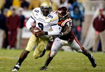 ATLANTA - OCTOBER 17:  Quarterback Josh Nesbitt #9 of the Georgia Tech Yellow Jackets rushes upfield away from Nekos Brown #47 of the Virginia Tech Hokies at Bobby Dodd Stadium on October 17, 2009 in Atlanta, Georgia.  (Photo by Kevin C. Cox/Getty Images)