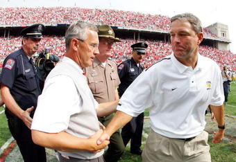 COLUMBUS, OH - SEPTEMBER 24:  Head coach Jim Tressel of Ohio State receives a hand shake from head coach Kirk Ferentz of Iowa after the fourth quarter on September 24, 2005 at Ohio Stadium in Columbus, Ohio. Ohio State defeated Iowa 31-6.  (Photo by Harry How/Getty Images)