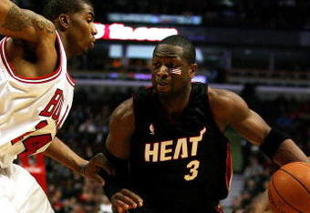 CHICAGO - FEBRUARY 12: Dwyane Wade #3 of the Miami Heat drives between Tyrus Thomas #24 and Ben Gordon #7 of the Chicago Bulls on February 12, 2009 at the United Center in Chicago, Illinois. The Heat defeated the Bulls 95-93. NOTE TO USER: User expressly acknowledges and agreees that, by downloading and/or using this Photograph, User is consenting to the terms and conditions of the Getty Images License Agreement. (Photo by Jonathan Daniel/Getty Images)