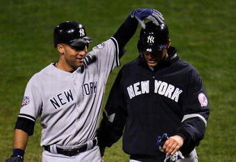 PHILADELPHIA - OCTOBER 31:  Derek Jeter #2 of the New York Yankees celebrates scoring in the fifth inning on a Johnny Damon double with Andy Pettitte #46 against the Philadelphia Phillies in Game Three of the 2009 MLB World Series at Citizens Bank Park on October 31, 2009 in Philadelphia, Pennsylvania.  (Photo by Jeff Zelevansky/Getty Images)
