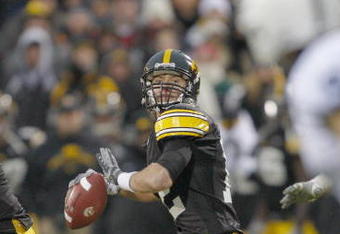 IOWA CITY, IOWA - NOVEMBER 8: Quarterback Ricky Stanzi #12 of the Iowa Hawkeyes looks down field for a receiver during the fourth quarter of play against the Penn State Nittany Lions at Kinnick Stadium on November 8, 2008 in Iowa City, Iowa. Iowa defeated Penn State  24-23. (Photo by David Purdy/Getty Images)