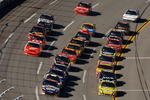 TALLADEGA, AL - NOVEMBER 01: David Reutimann, driver of the #00 Aaron's Dream Machine Toyota, and Carl Edwards, driver of the #99 SUBWAY Ford, lead the field during the NASCAR Sprint Cup Series AMP Energy 500 at Talladega Superspeedway on November 1, 2009 in Talladega, Alabama.  (Photo by Chris Graythen/Getty Images)