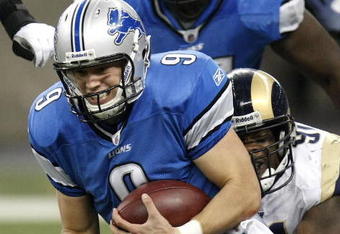 DETROIT , MI - NOVEMBER 01:  Matthew Stafford #9 of the Detroit Lions is tackled by Leonard Little #91 of the St. Louis Rams on November 1, 2009 at Ford Field in Detroit, Michigan.  (Photo by Gregory Shamus/Getty Images)