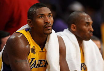 LOS ANGELES, CA - OCTOBER 27:  (L-R) Ron Artest #37 and Kobe Bryant #24 of the Los Angeles Lakers sit on the bench during the season opening game against the Los Angeles Clippers at Staples Center on October 27, 2009 in Los Angeles, California.  The Lakers won 99-92.  NOTE TO USER: User expressly acknowledges and agrees that, by downloading and or using this photograph, User is consenting to the terms and conditions of the Getty Images License Agreement. Mandatory Copyright Notice: Copyright 2009 NBAE  (Photo by Kevork Djansezian/Getty Images)