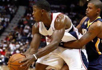 ATLANTA - OCTOBER 28:  Joe Johnson #2 of the Atlanta Hawks controls the ball against Earl Watson #2 of the Indiana Pacers at Philips Arena on October 28, 2009 in Atlanta, Georgia.  (Photo by Kevin C. Cox/Getty Images)