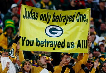 GREEN BAY, WI - NOVEMBER 01:  Fans hold a sign referring to quarterback Brett Favre #4 of the Minnesota Vikings during the game against the Green Bay Packers at Lambeau Field on November 1, 2009 in Green Bay, Wisconsin. (Photo by Scott Boehm/Getty Images)