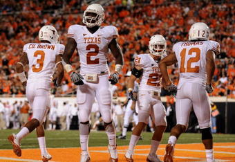 STILLWATER, OK - OCTOBER 31:  Earl Thomas #12 Sergio Kindle #2 of the Texas Longhorns celebrates a touchdown scored by teammate Earl Thomas #12 (R) on an interception in the third quarter against the Oklahoma State Cowboys at Boone Pickens Stadium on October 31, 2009 in Stillwater, Oklahoma.  (Photo by Ronald Martinez/Getty Images)