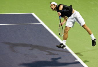 SHANGHAI, CHINA - OCTOBER 15:  Jurgen Melzer of Austria serves to Feliciano Lopez of Spain during day five of 2009 Shanghai ATP Masters 1000 at Qi Zhong Tennis Centre on October 15, 2009 in Shanghai, China.  (Photo by Victor Fraile/Getty Images)