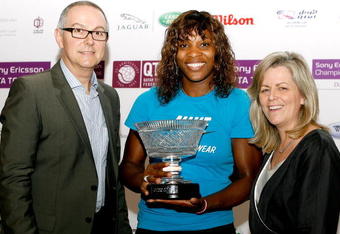 DOHA, QATAR - NOVEMBER 01:  Aldo Liguori, head of global public relations for Sony Ericsson and Sony Ericsson WTA Tour CEO Stacey Allaster pose with Serena Williams (C) after she was presented a trophy to commerate finishing the year as number 1 in the Sony Ericsson WTA Tour rankings after the final of the Sony Ericsson WTA Championships at the Khalifa International Tennis and Squash Complex on November 1, 2009 in Doha, Qatar.  (Photo by Matthew Stockman/Getty Images)