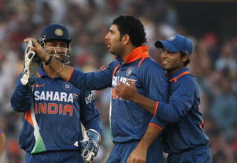 MOHALI, INDIA - NOVEMBER 02:  Yuvraj Singh is congratulated by his team mates MS Dhoni and Ravindra Jadeja of India after the wicket of Michael Hussey of Australia during the fourth One Day International match between India and Australia at Punjab Cricket Association Stadium on November 2, 2009 in Mohali, India.  (Photo by Mark Kolbe/Getty Images)