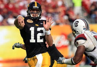 TAMPA, FL - JANUARY 01:  Ricky Stanzi #12 of the Iowa Hawkeyes drops back to pass against the South Carolina Gamecocks during the Outback Bowl on January 1, 2009 at Raymond James Stadium in Tampa, Florida.  (Photo by Scott Halleran/Getty Images)