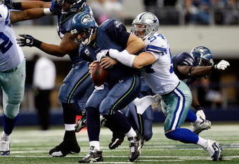 ARLINGTON, TX - NOVEMBER 01:  Quarterback Matt Hasselbeck #8 of the Seattle Seahawks is sacked by Bobby Carpenter #54 of the Dallas Cowboys at Cowboys Stadium on November 1, 2009 in Arlington, Texas.  (Photo by Ronald Martinez/Getty Images)