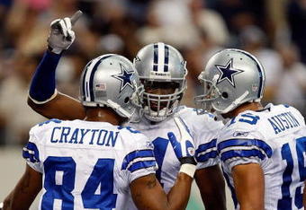 ARLINGTON, TX - NOVEMBER 01:  Wide receiver Roy Williams #11 celebrates a touchdown with Patrick Crayton #84 and Miles Austin #18 of the Dallas Cowboys at Cowboys Stadium on November 1, 2009 in Arlington, Texas.  (Photo by Ronald Martinez/Getty Images)