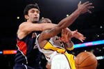 LOS ANGELES, CA - NOVEMBER 01:  Kobe Bryant #24 (R)  of the Los Angeles Lakers is fouled by Zaza Pachulia #27 of the Atlanta Hawks during the NBA basketball game at Staples Center on November 1, 2009 in Los Angeles, California. NOTE TO USER: User expressly acknowledges and agrees that, by downloading and/or using this Photograph, user is consenting to the terms and conditions of the Getty Images License Agreement.  (Photo by Kevork Djansezian/Getty Images)